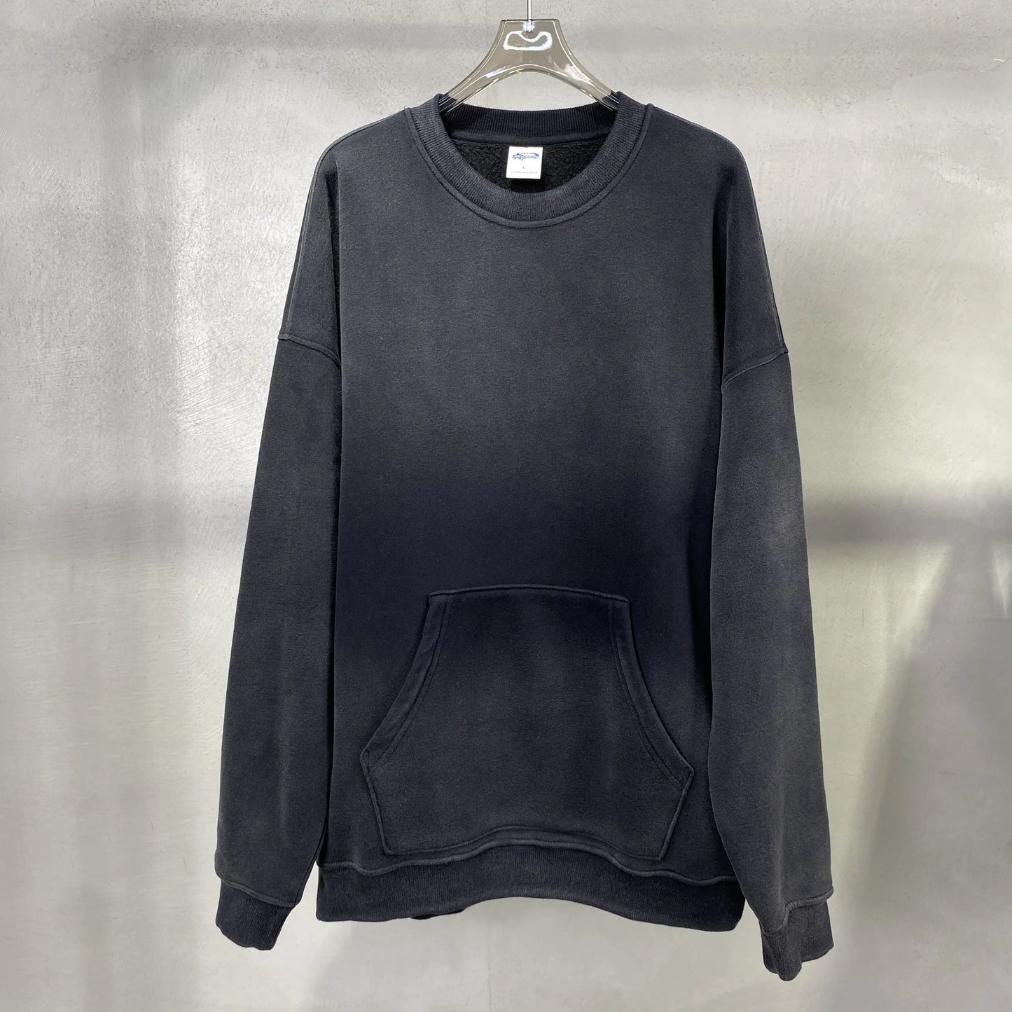 spray-dyed worn round neck sweater